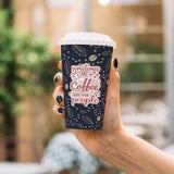 16 oz. Navy Full Wrap Recyclable Paper Cup, posed with a hand, outdoors.