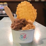 5 oz paper food container, with "Ice Cream" logo, filled with ice cream and waffle cone, on white table